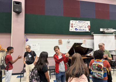 Professional musicians interact with students