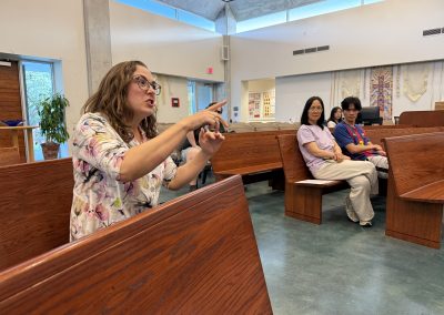 Teacher instructs from audience
