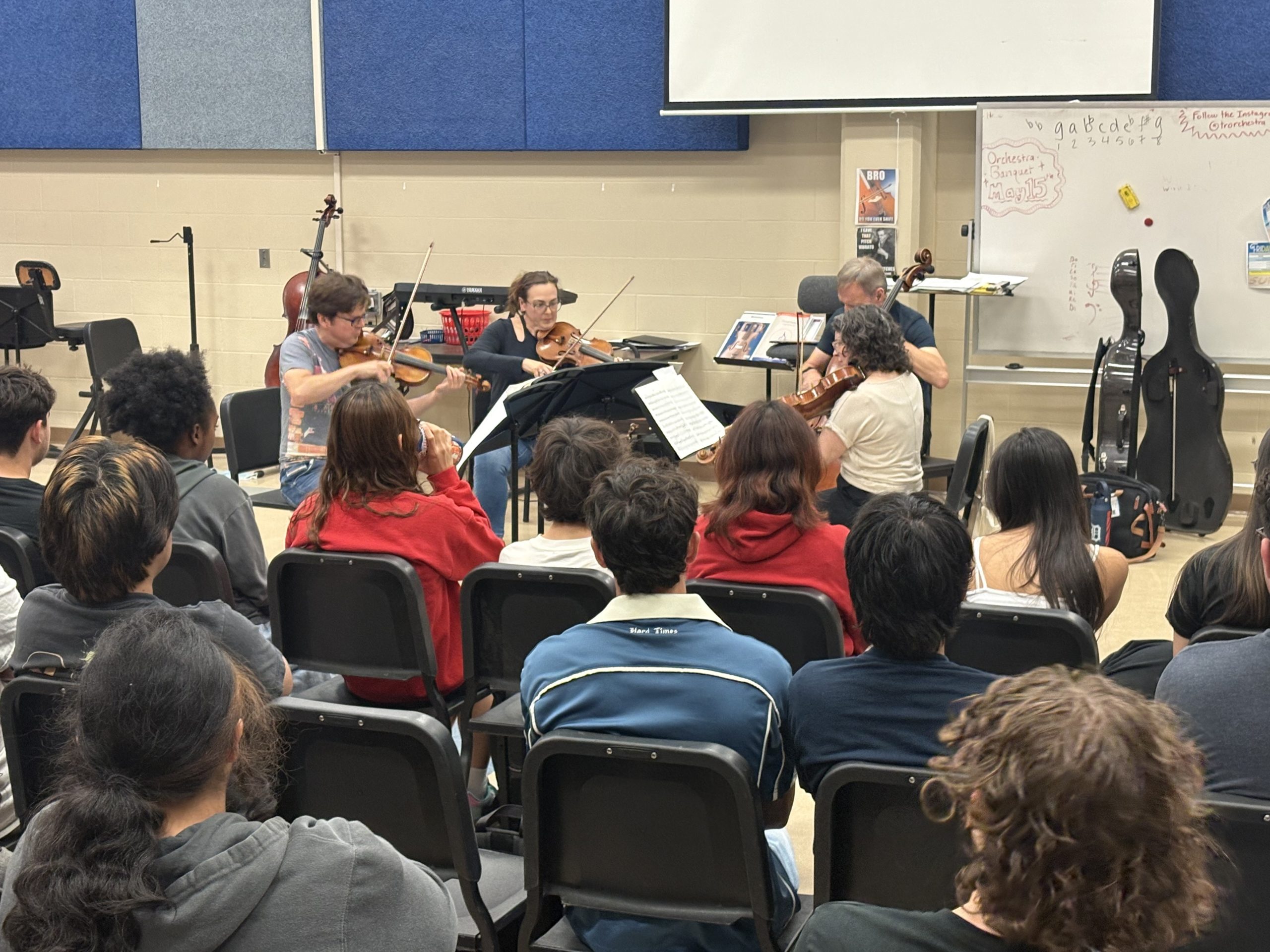 Professional quartet performs in classroom for students